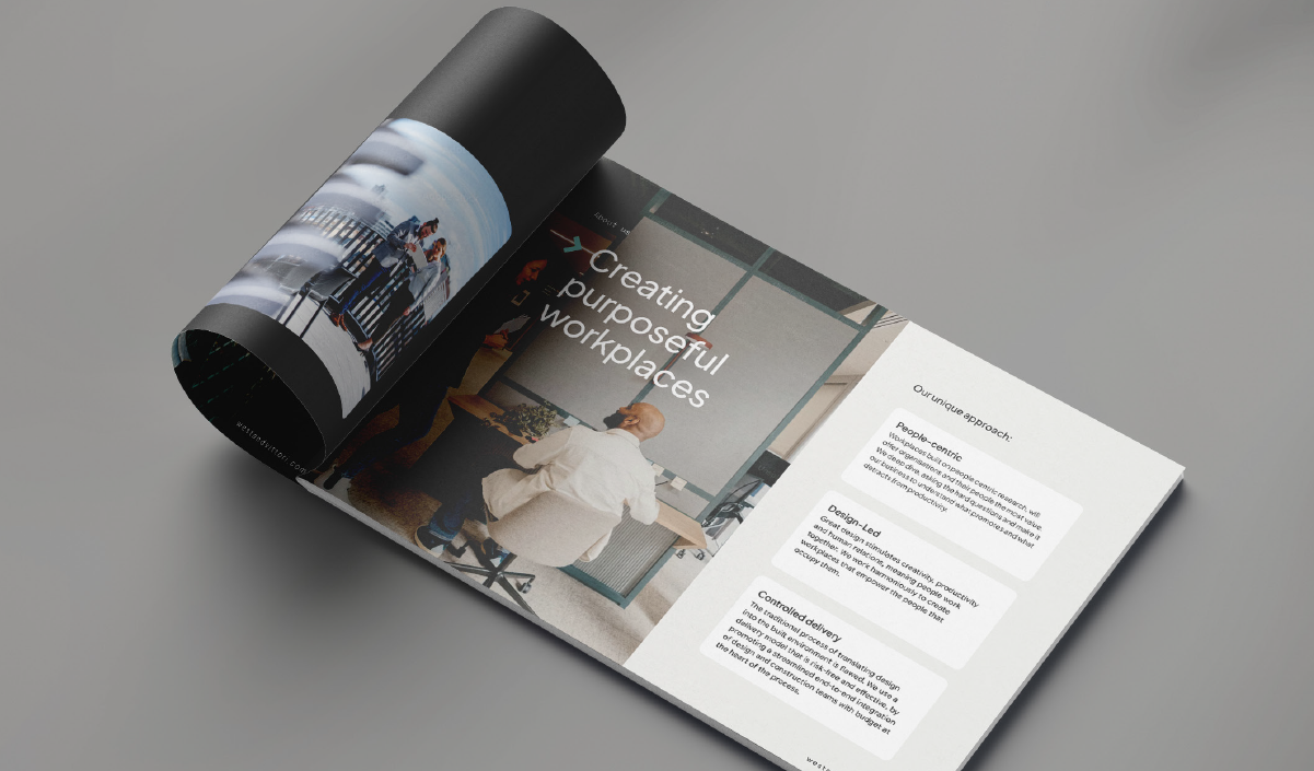 Open brochure showing pages about creating purposeful workplaces, with images of people in a modern office environment.