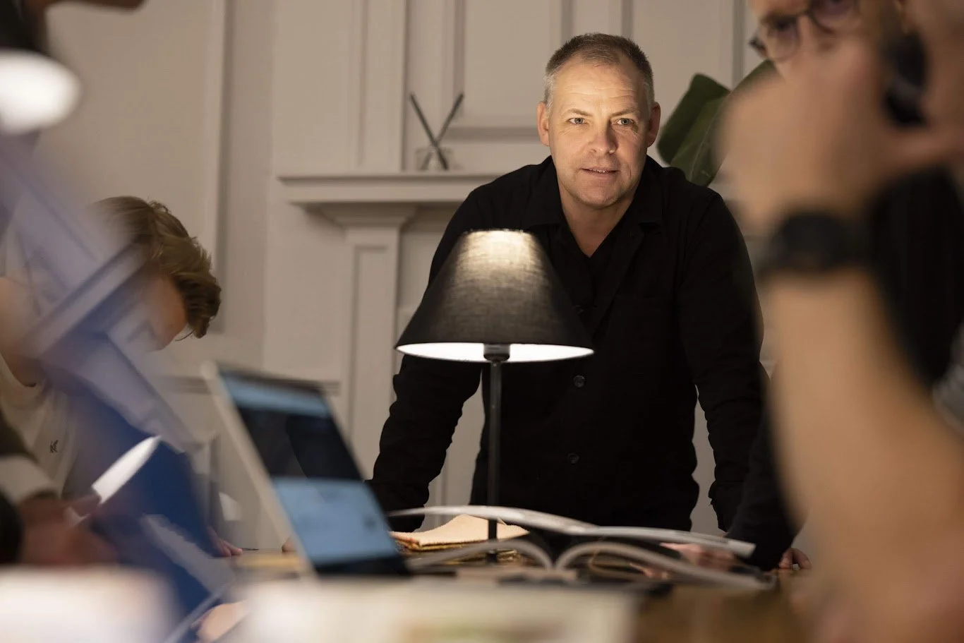 Dan Gillmore at a table with lamp