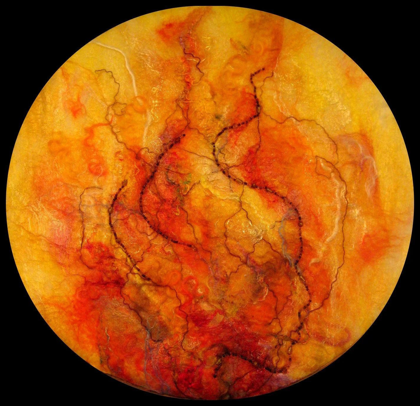 Felted image of flames with the silhouette of a woman's profile beaded in the centre of it, filling the frame.