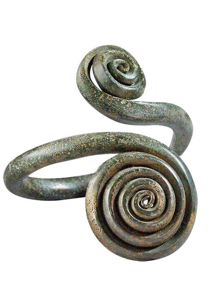 Close-up of an ancient, weathered metal spiral artifact against a black background.