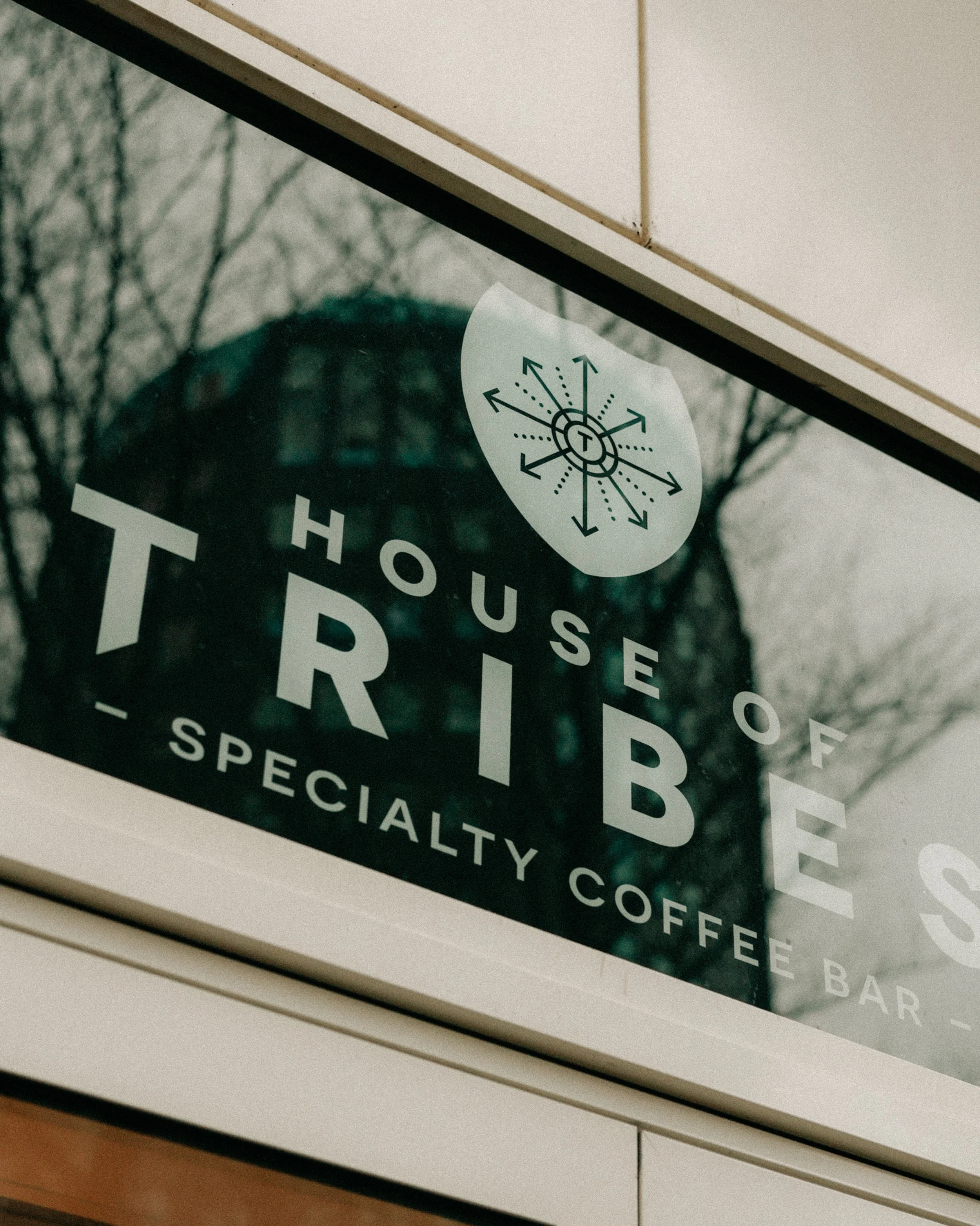 Sign for House of Tribe, a specialty coffee bar.