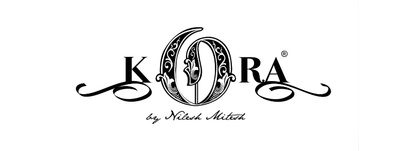 Kora logo with ornate decorative 'O' and signature text 'by Nilesh Mitesh' underneath.