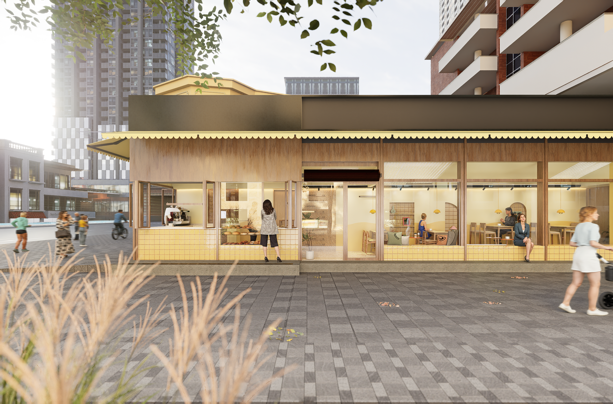 Een modern café met grote glazen ramen, binnen zitten mensen en kopen eten. Buiten spelen en wandelen mensen op een trottoir met stenen tegels. In de achtergrond hoge gebouwen en bomen.