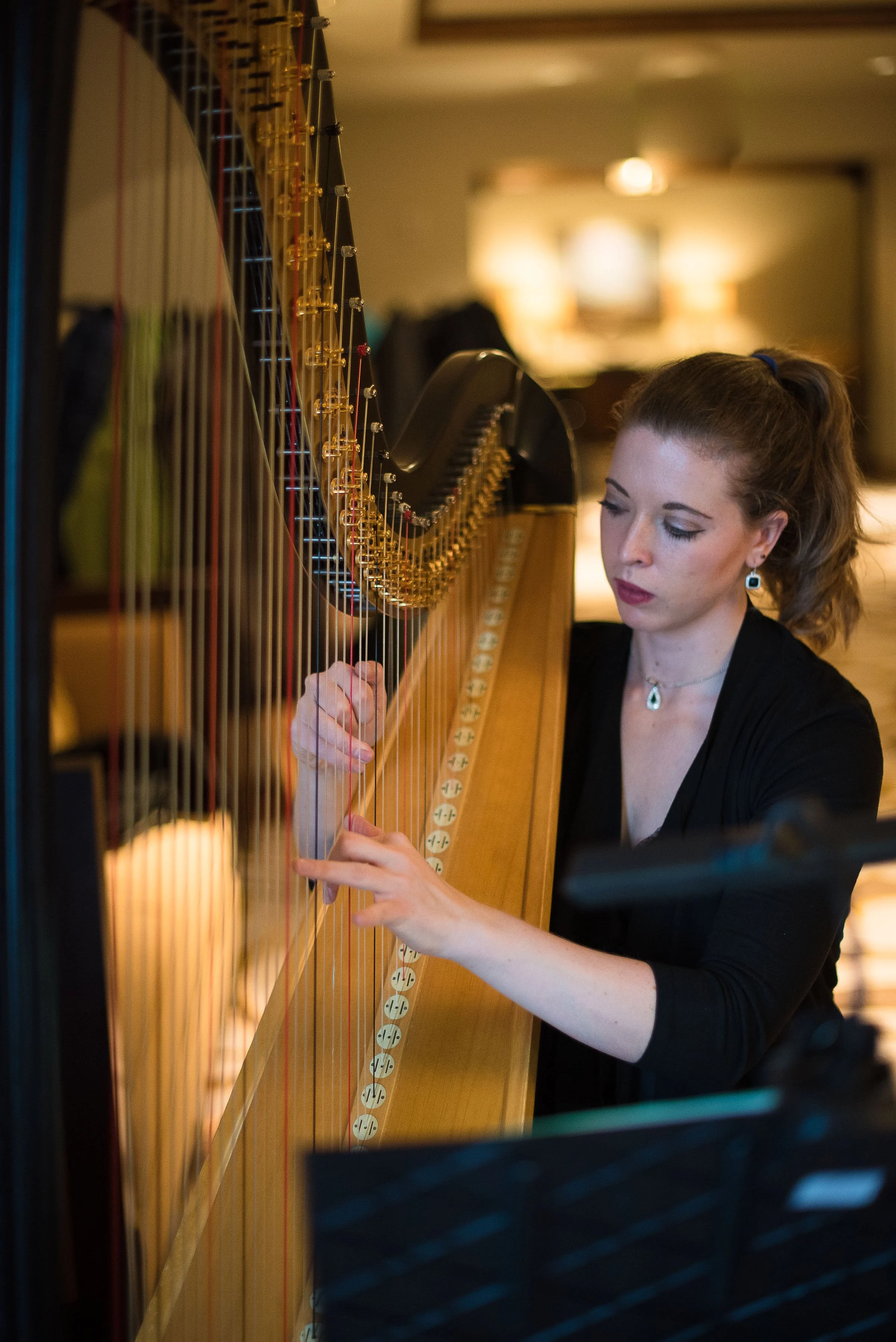 Jenna Hunt performing harp at The Ritz-Carlton wedding ceremony in Avon