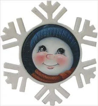 A decorative snowflake with a cute, smiling face of a snowperson with rosy cheeks, a pink nose, and big eyes, placed inside the snowflake