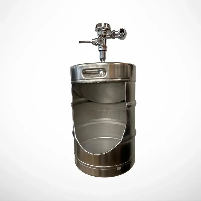 Stainless steel beer keg urinal installed in a bar bathroom