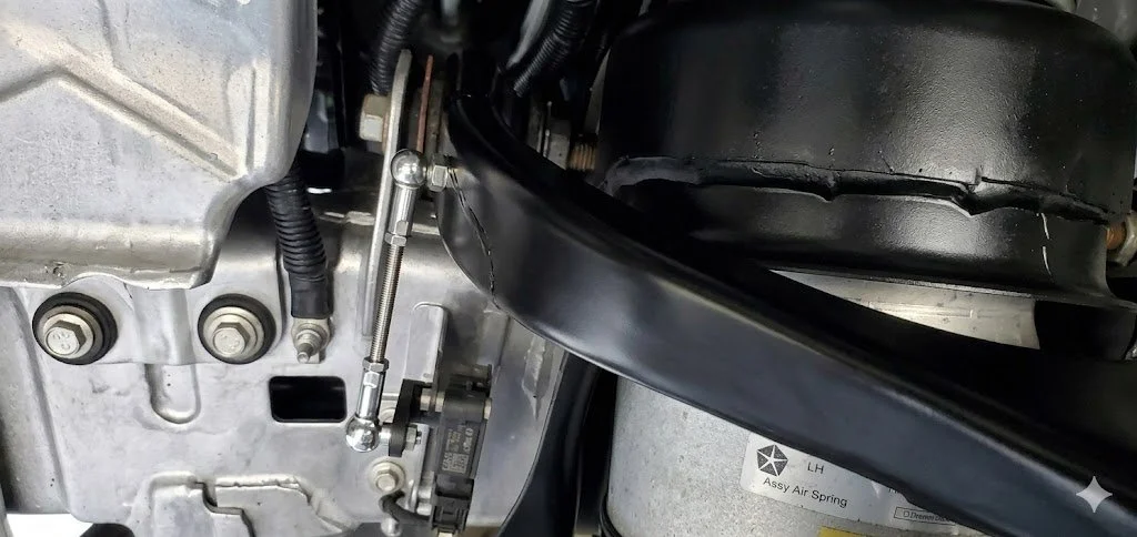 Adjustable lowering link installed on Ram 1500 air suspension ride height sensor