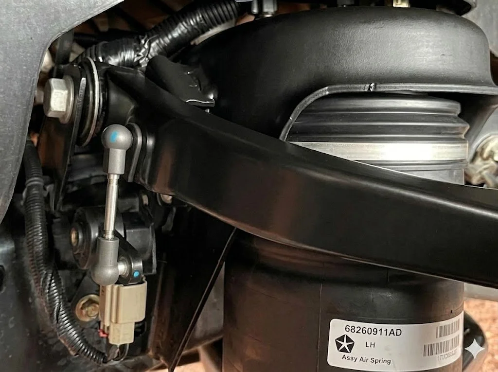 Factory ride height sensor link on Ram 1500 before installing adjustable lowering links
