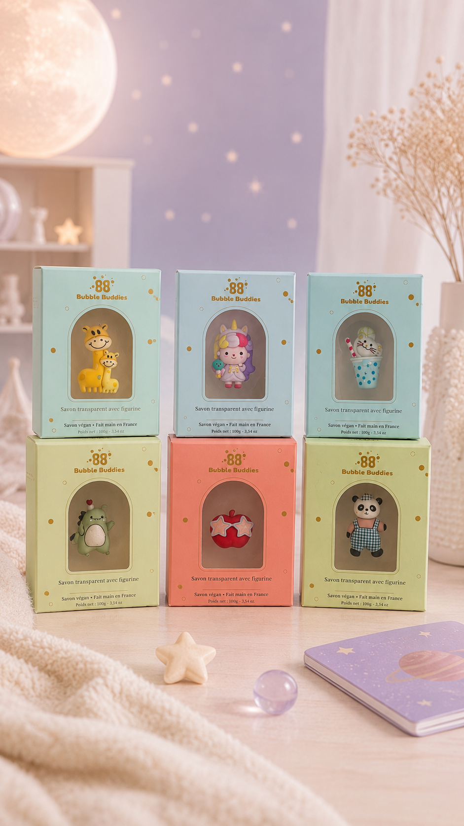 Six Bubble Buddies handmade transparent soap boxes with collectible figurines displayed in pastel. Made in France Vegan