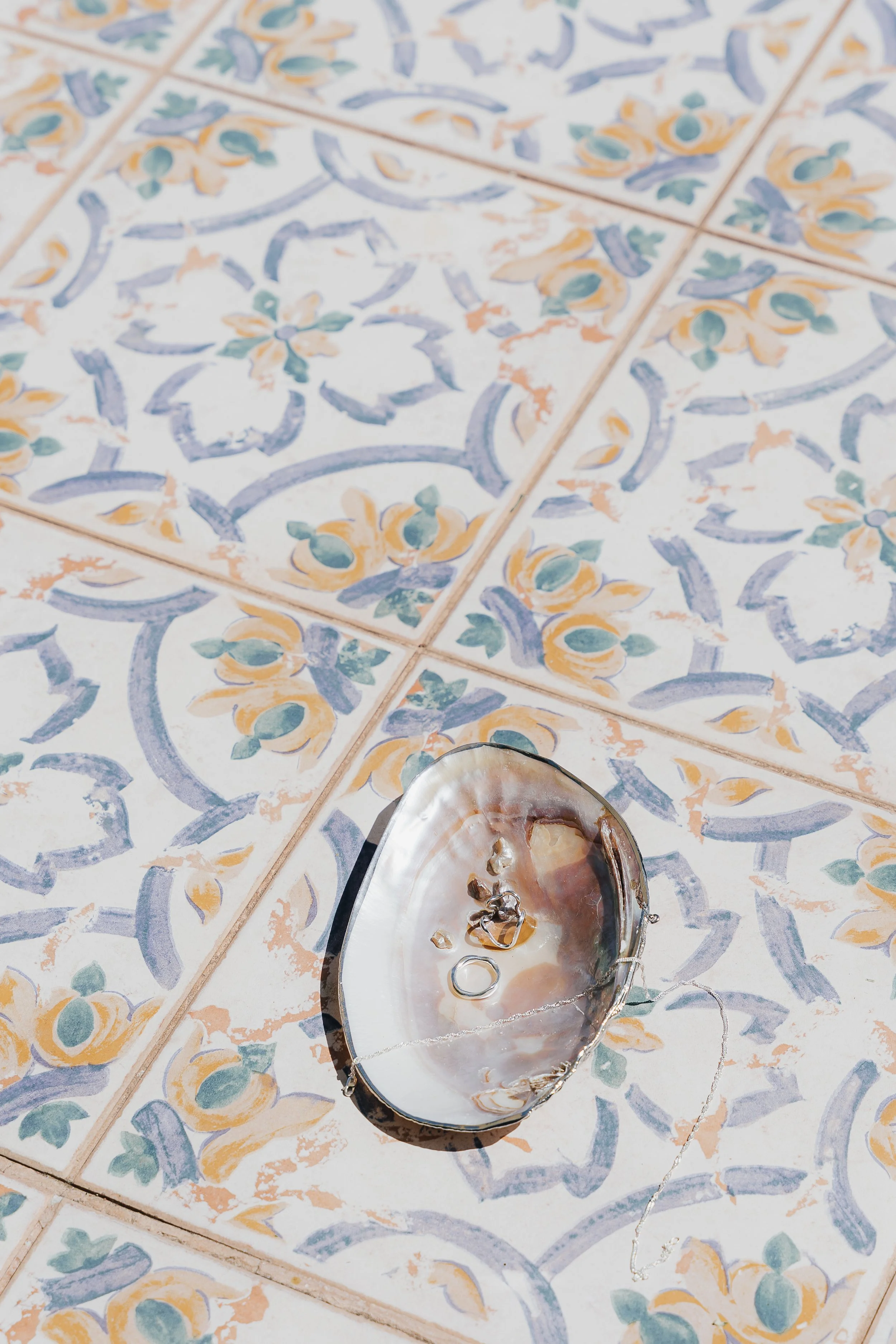 Mother-of-pearl shell dish on hand-painted Mallorcan tiles at Ca’s Xorc
