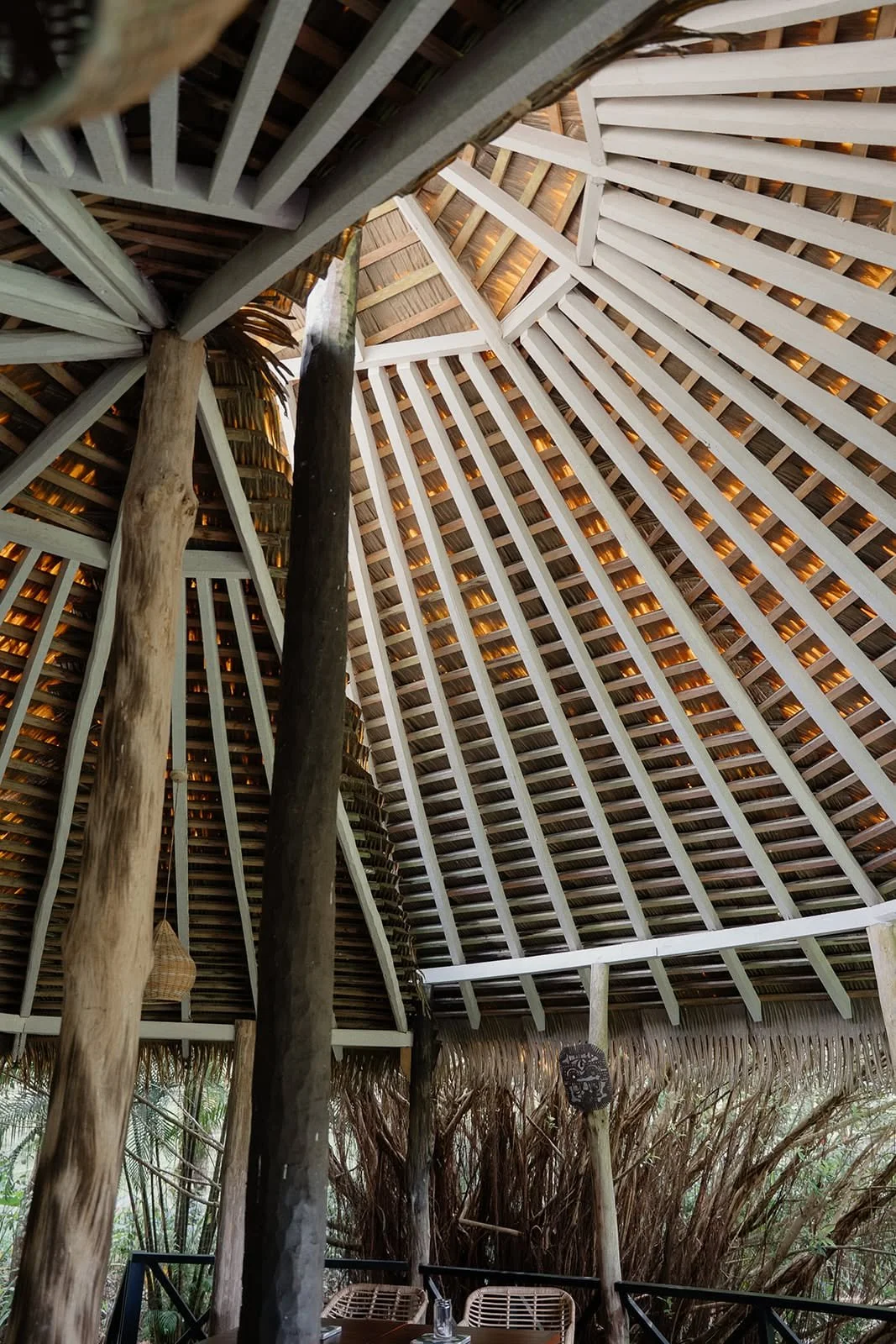Looking up at the radiating timber and thatch roof structure of a pavilion at Huma Terra Lodge, Sri Lanka