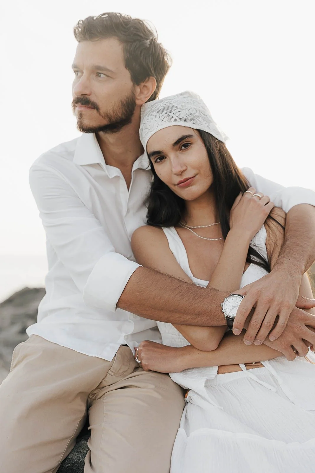 Couple holding each other close at golden hour – Mallorca editorial by Anna van der Veen