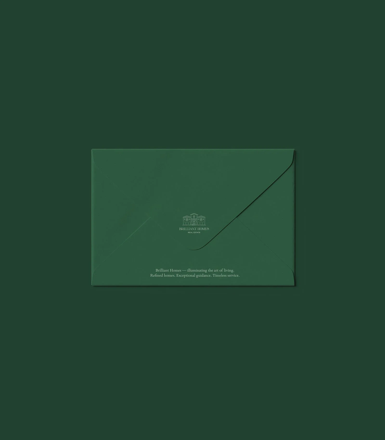 Sobre de color verde con logotipo y texto de la empresa Brilliant Homes
