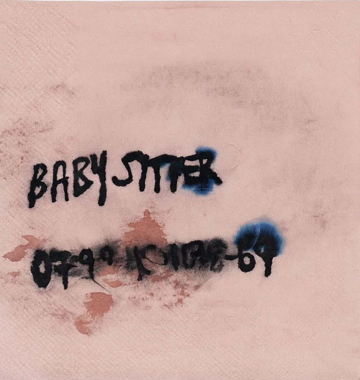 Graffiti on a pink wall with the words 'BABY SITTER" and a phone number, both partially obscured by blue spray paint and smudges.