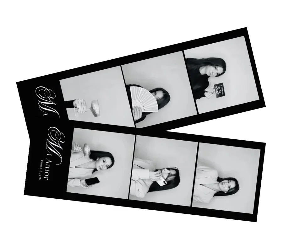 Black and white photo booth strip featuring a young woman in various poses with different props, including a fan and a phone, against a plain background.