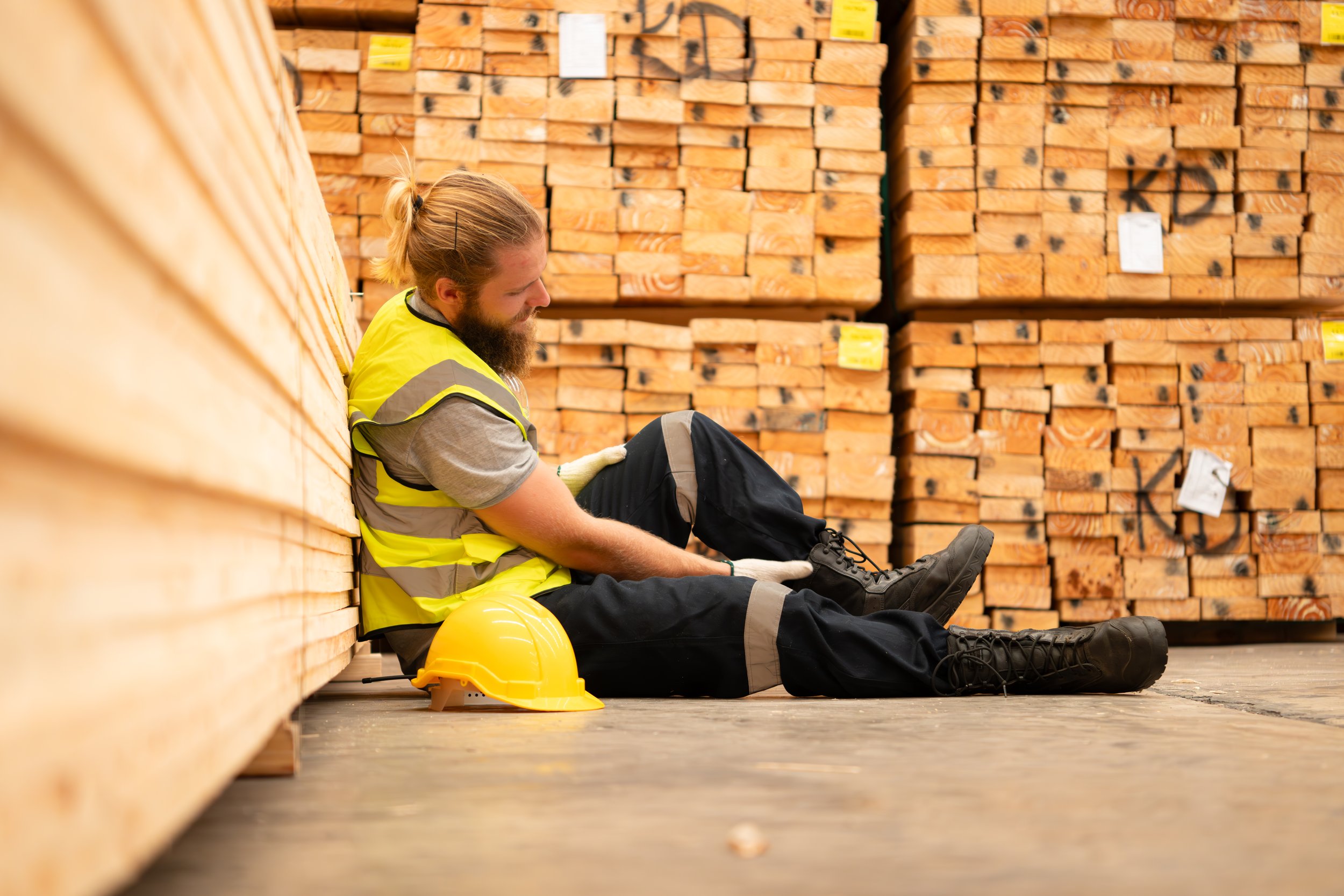 Man sits down while recovering from injury in the workplace
