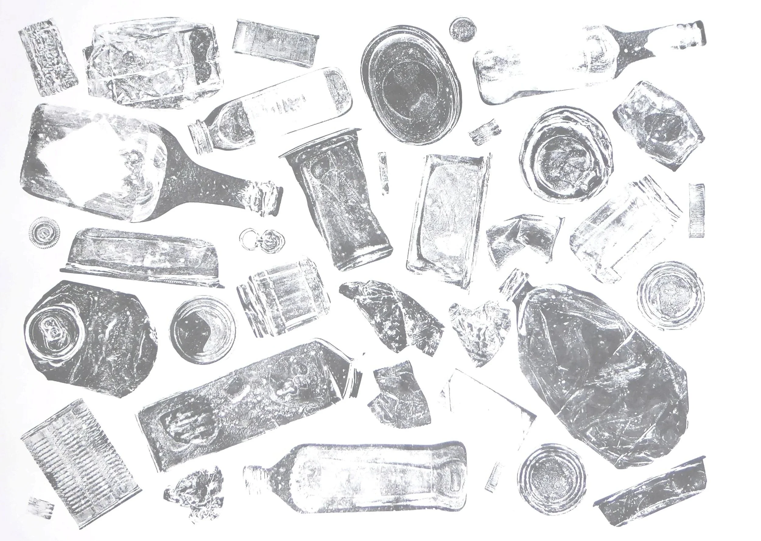Black and white photo of various bottles and cans scattered on a surface.