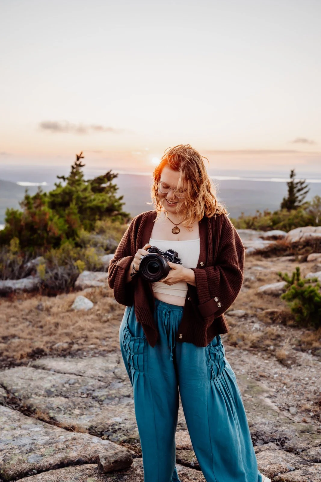 woman with camera on mountain