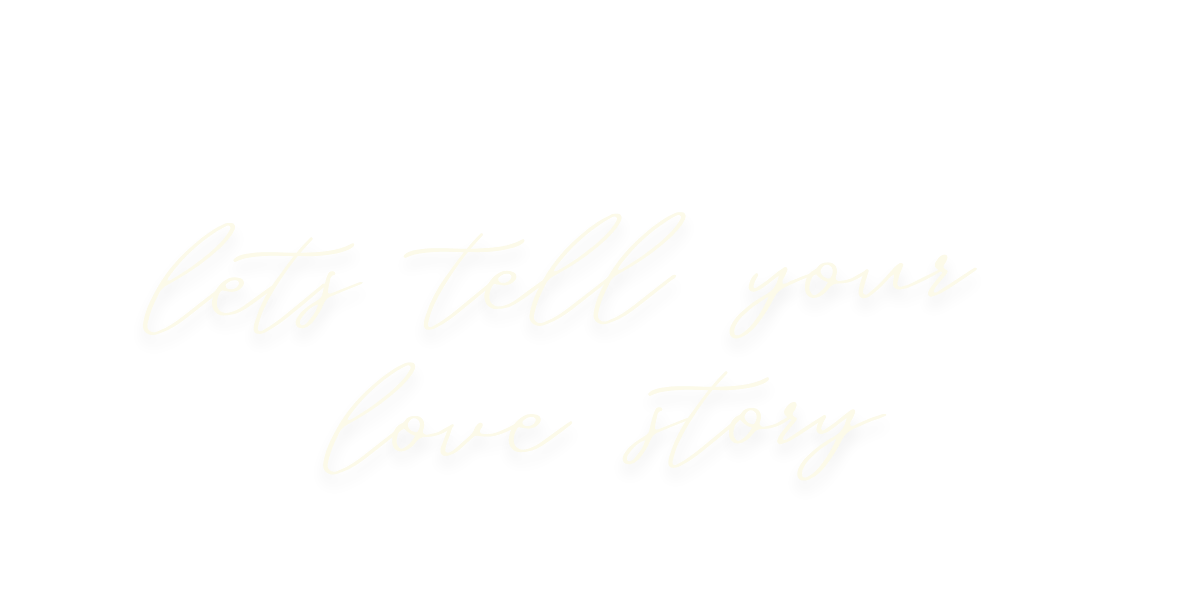 Black background with white cursive text that reads "Let's tell your love story".
