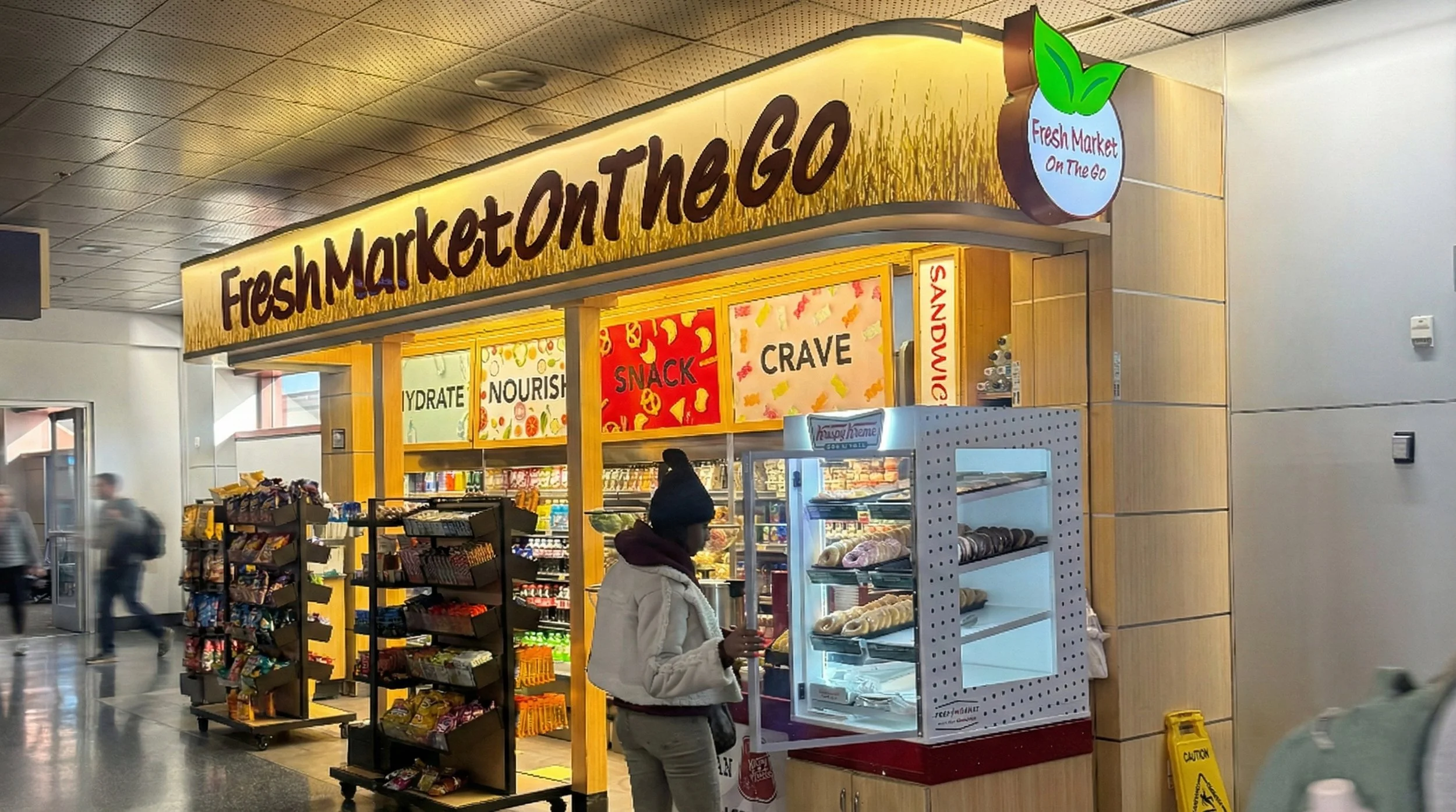Image of a person purchasing a donut at Fresh Market