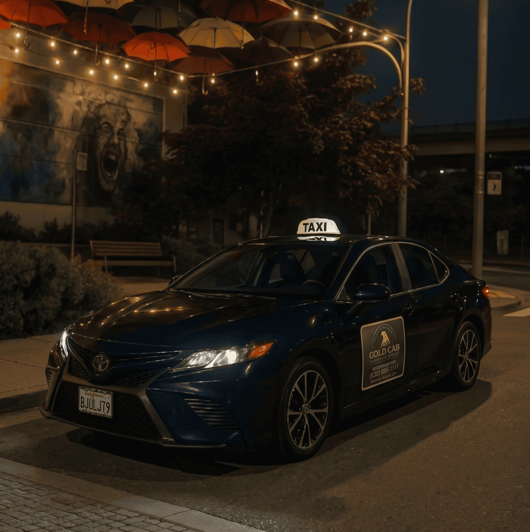 Nighttime street scene featuring a black sedan with a taxi sign on top, and an advertisement for 'Gold Cab' on the side door. In the background, an illuminated wall mural of a roaring lion's face, decorative string lights, and several umbrellas hanging overhead can be seen.