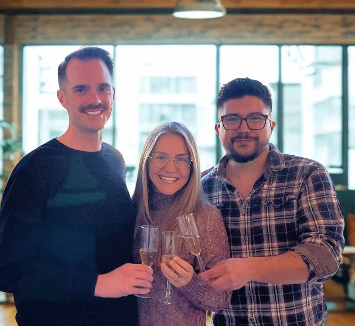 Rueben Wuerdeman, a top Eureka MO real estate agent, standing next to a man and a woman smiling because they just closed on their new home in Eureka MO