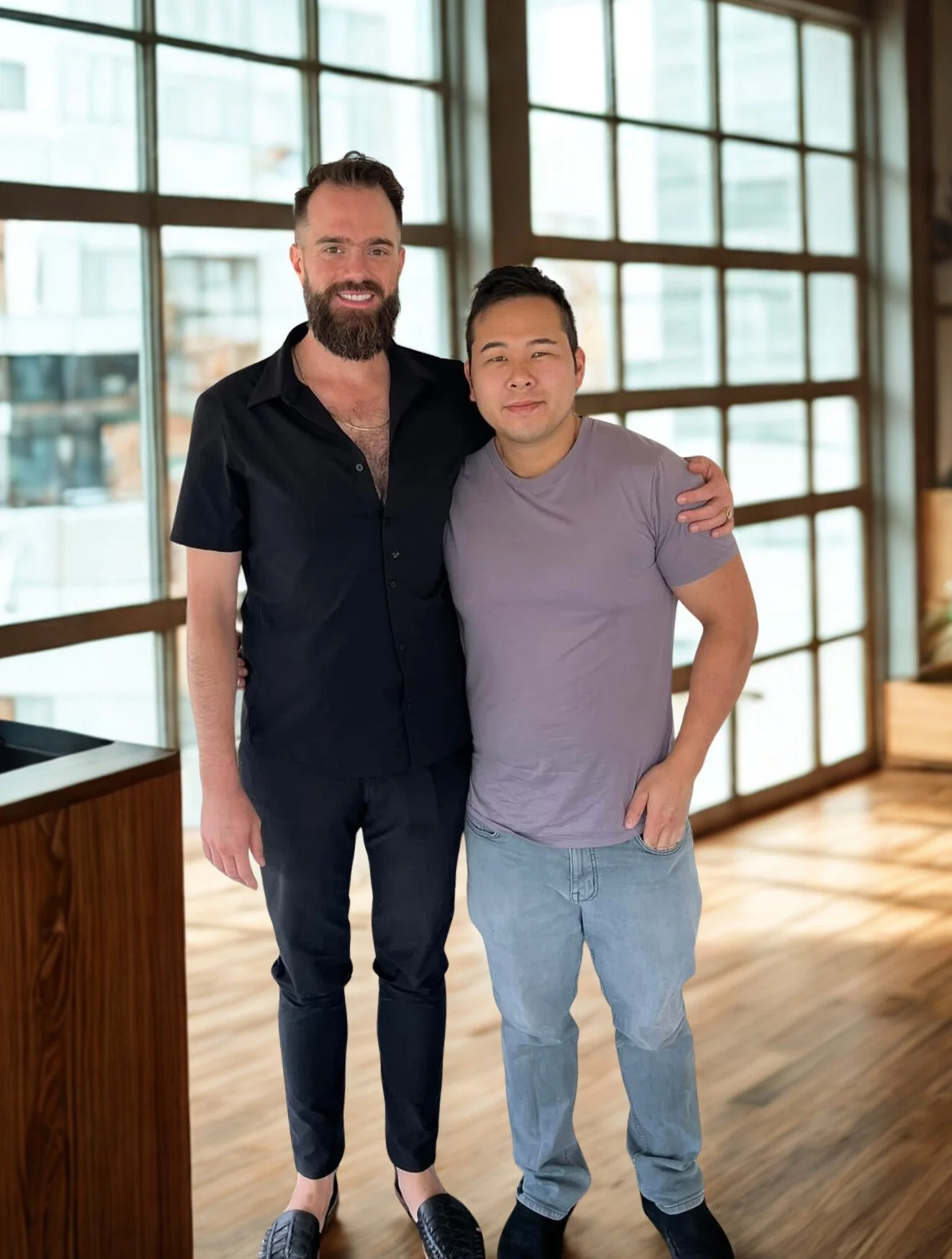 Rueben Wuerdeman, a top Eureka MO real estate agent, standing next to his client a man smiling because he just closed on his new home in Eureka MO 
