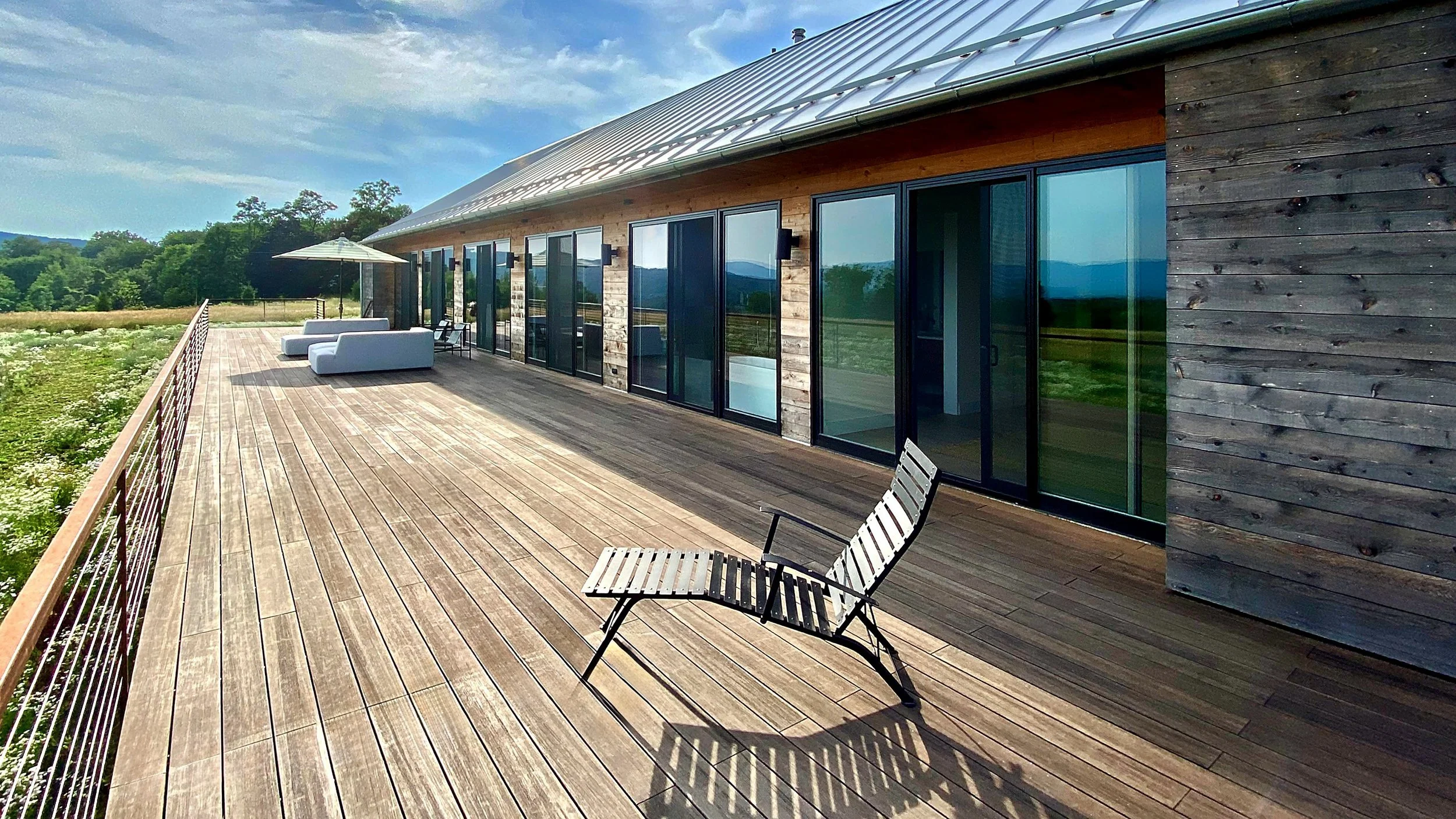 Medusa exterior deck surrounded by meadows.