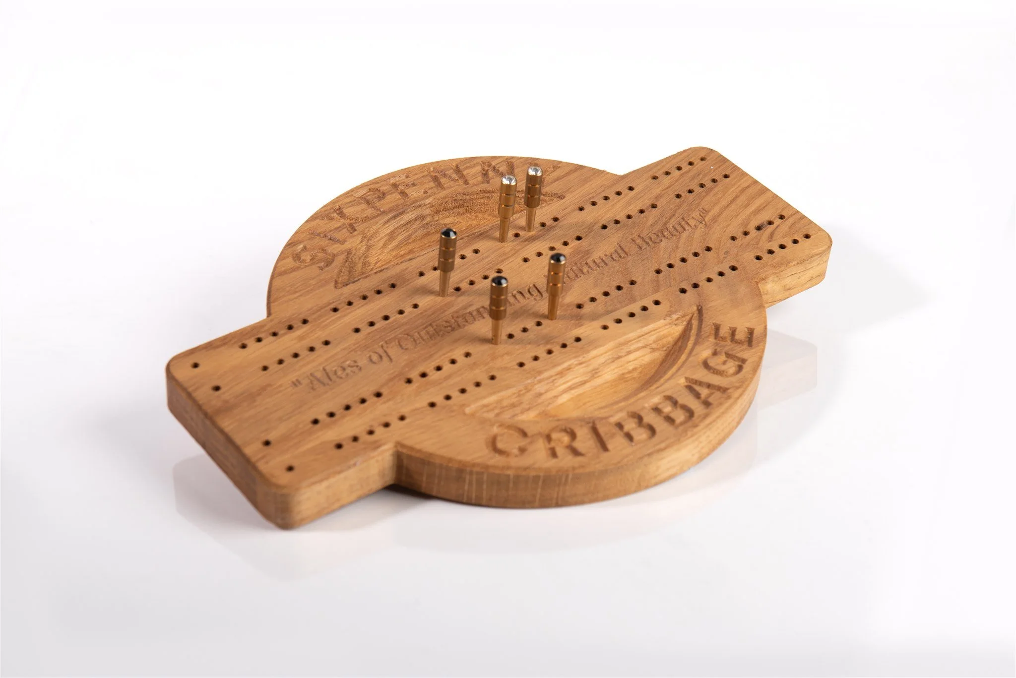 Wooden cribbage board with metal pegs and engraved text