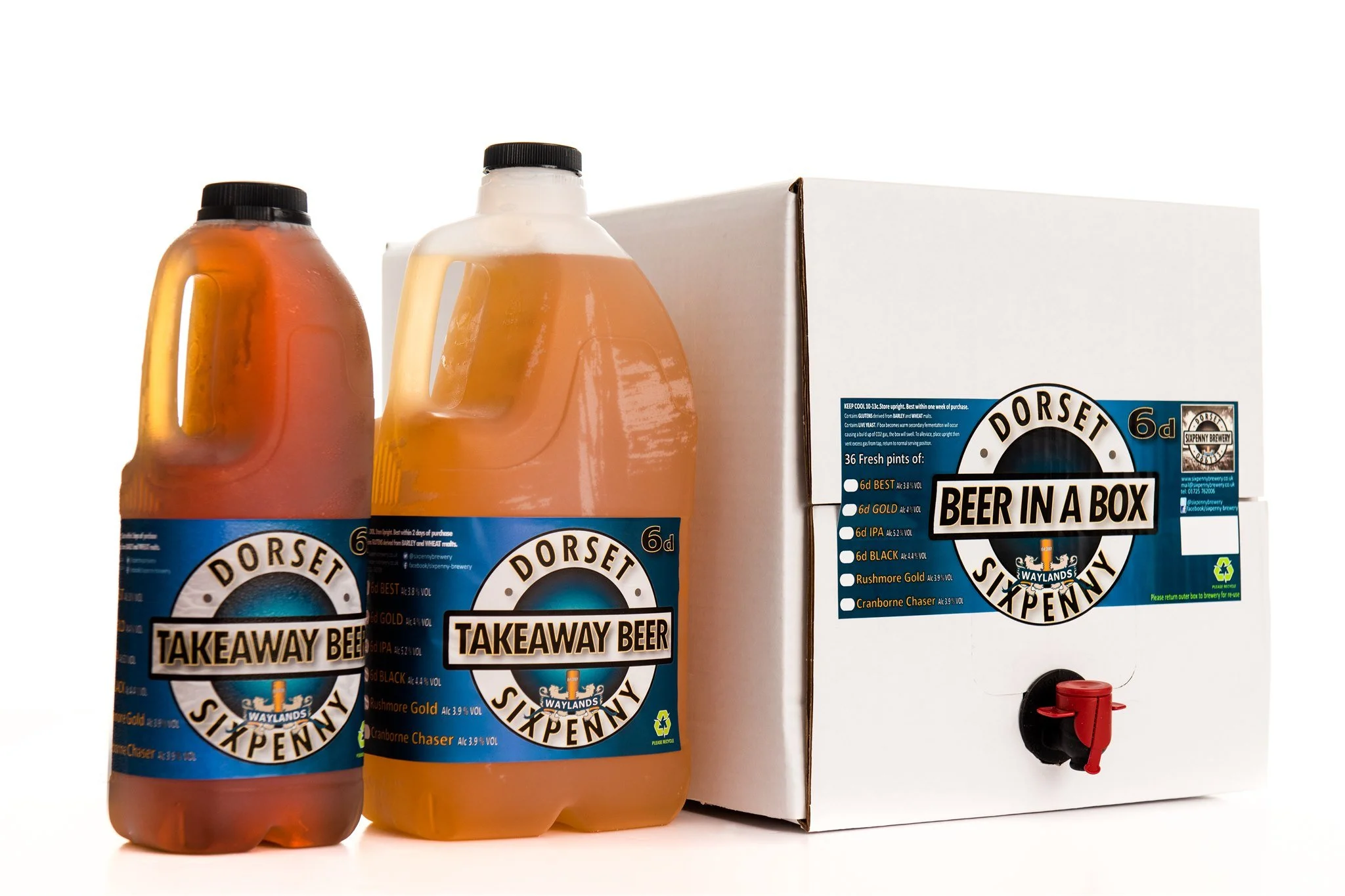 Two bottles of Dorset takeaway beer placed next to a box labeled 'Beer in a Box,' with a red spigot at the bottom.