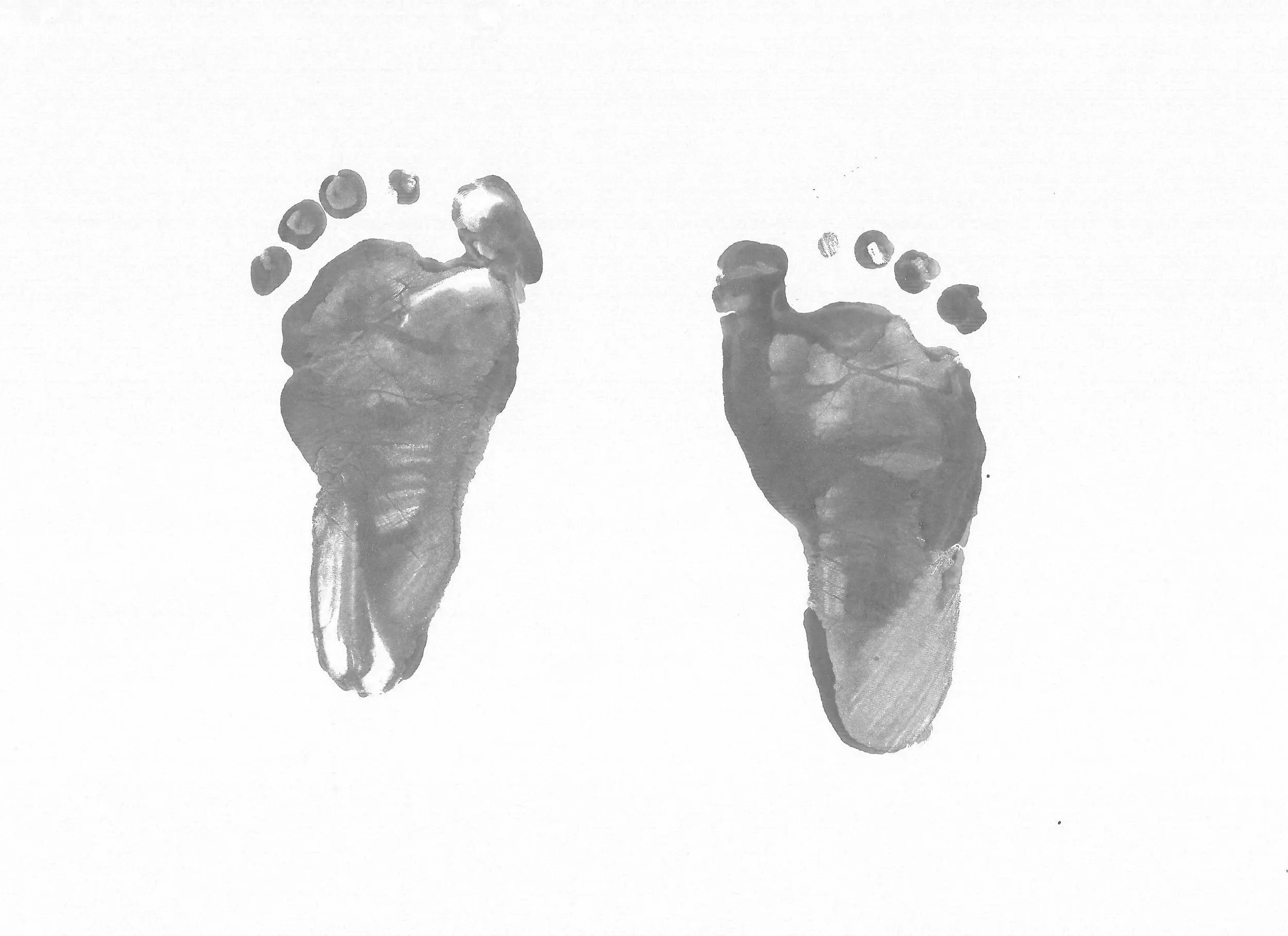 Tiny baby footprints on a soft background