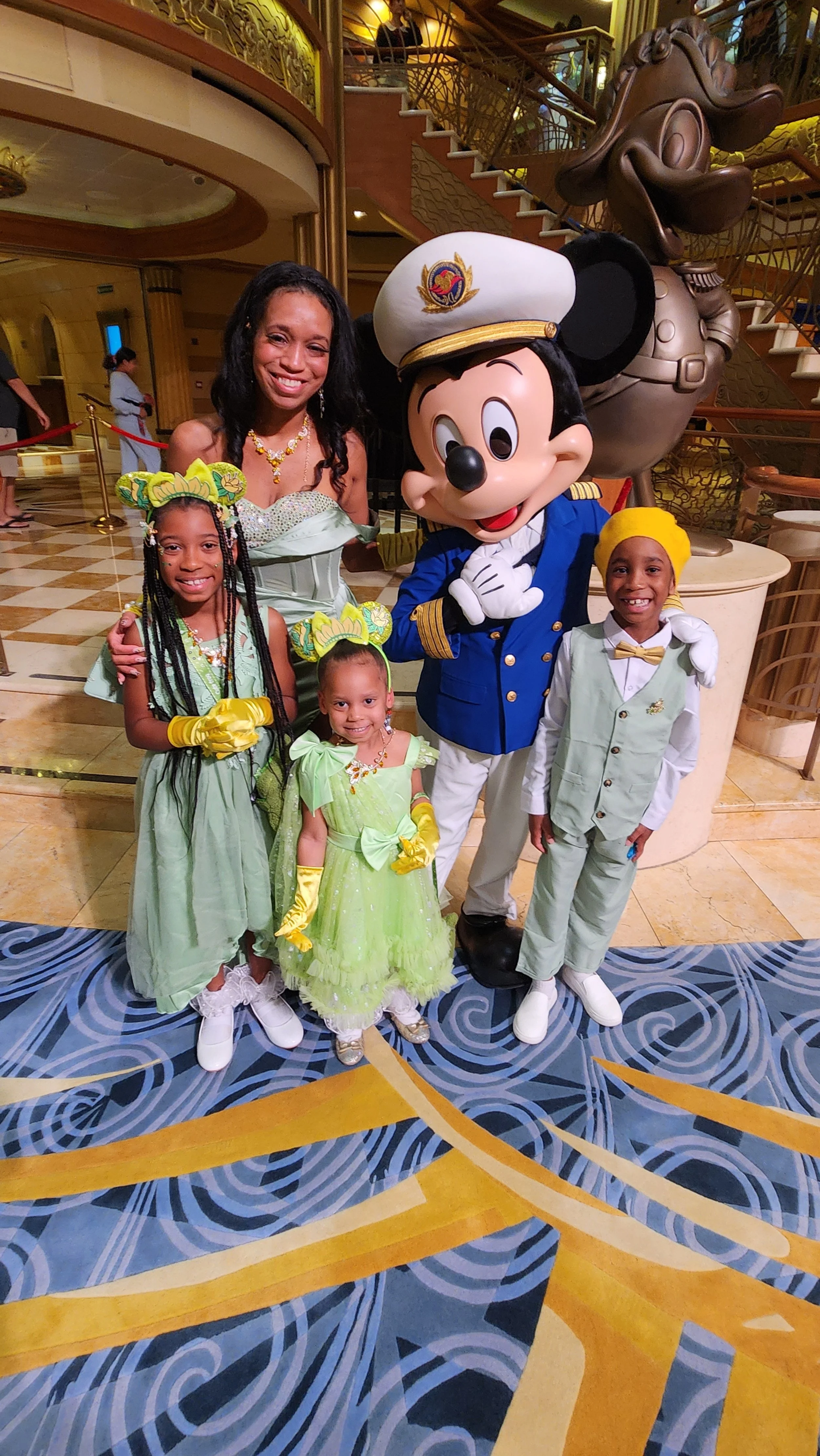 Baby Steps founder smiling with three children