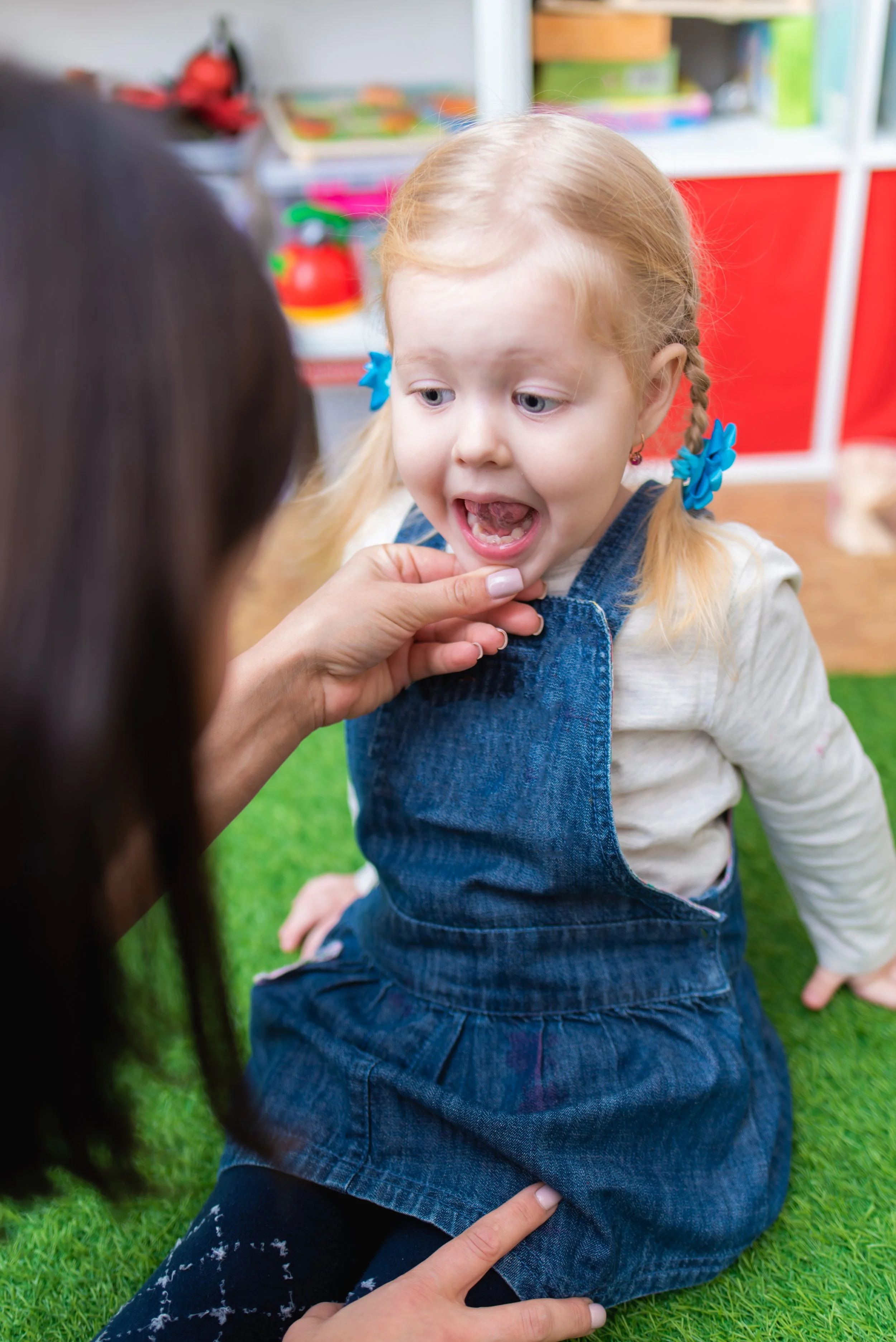 child working with a speech therapist