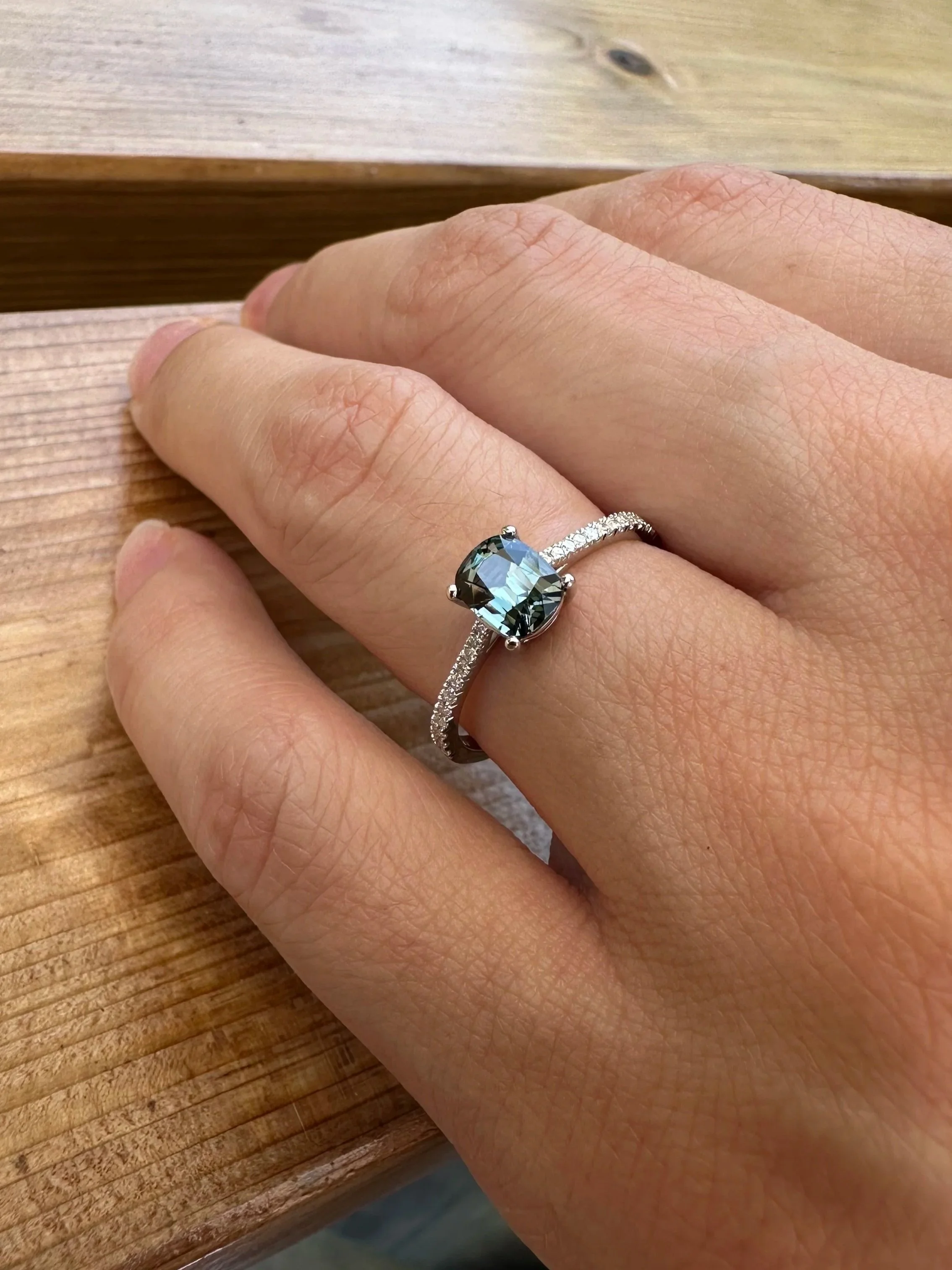 Teal green spinel ring in 14K gold worn on finger, fine jewellery by Gugunava Jewelry London