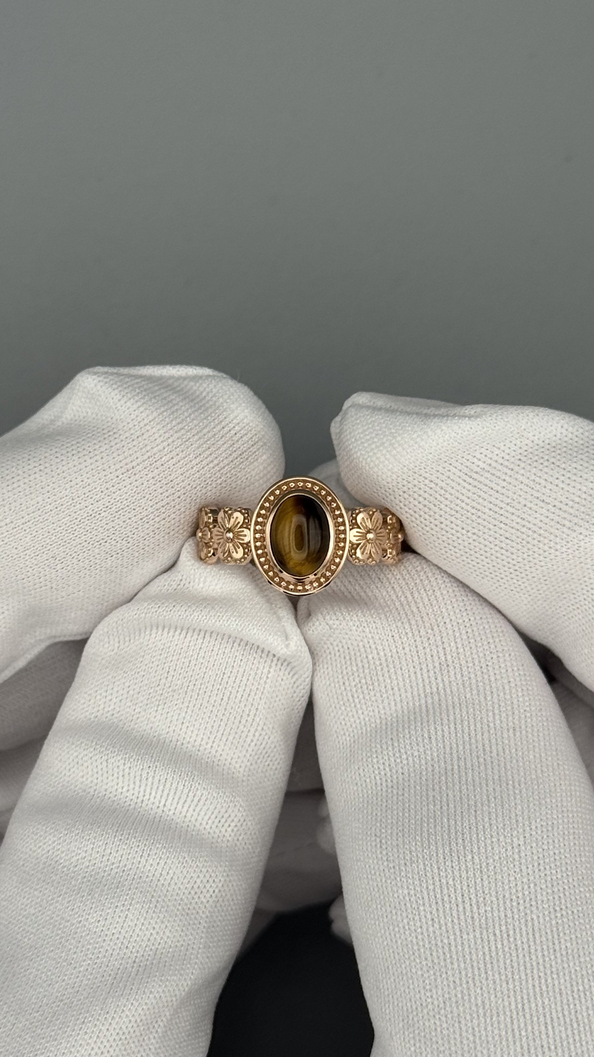Front view of Wildflower Ring — oval tiger's eye cabochon in beaded bezel with sculpted floral band, 14K rose gold, Gugunava Jewelry London