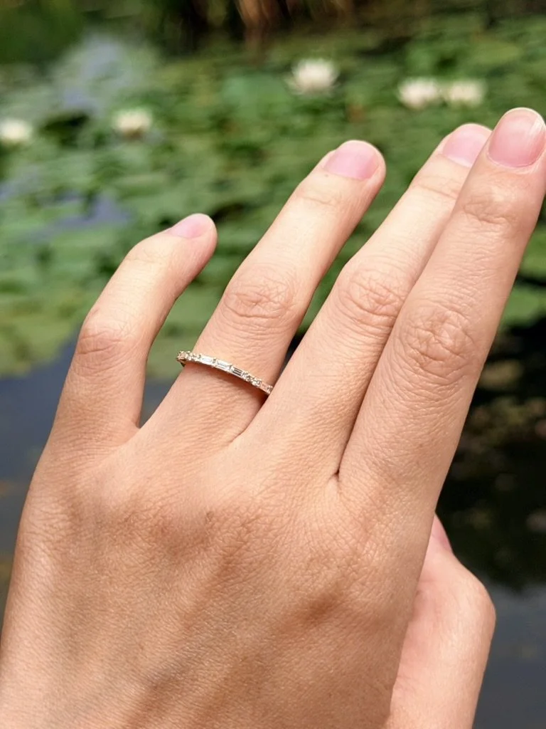 Baguette and round lab-grown diamond ring in 9ct yellow gold worn on the hand — alternating baguette and round brilliants, 0.34ct total. Gugunava Jewelry, London.