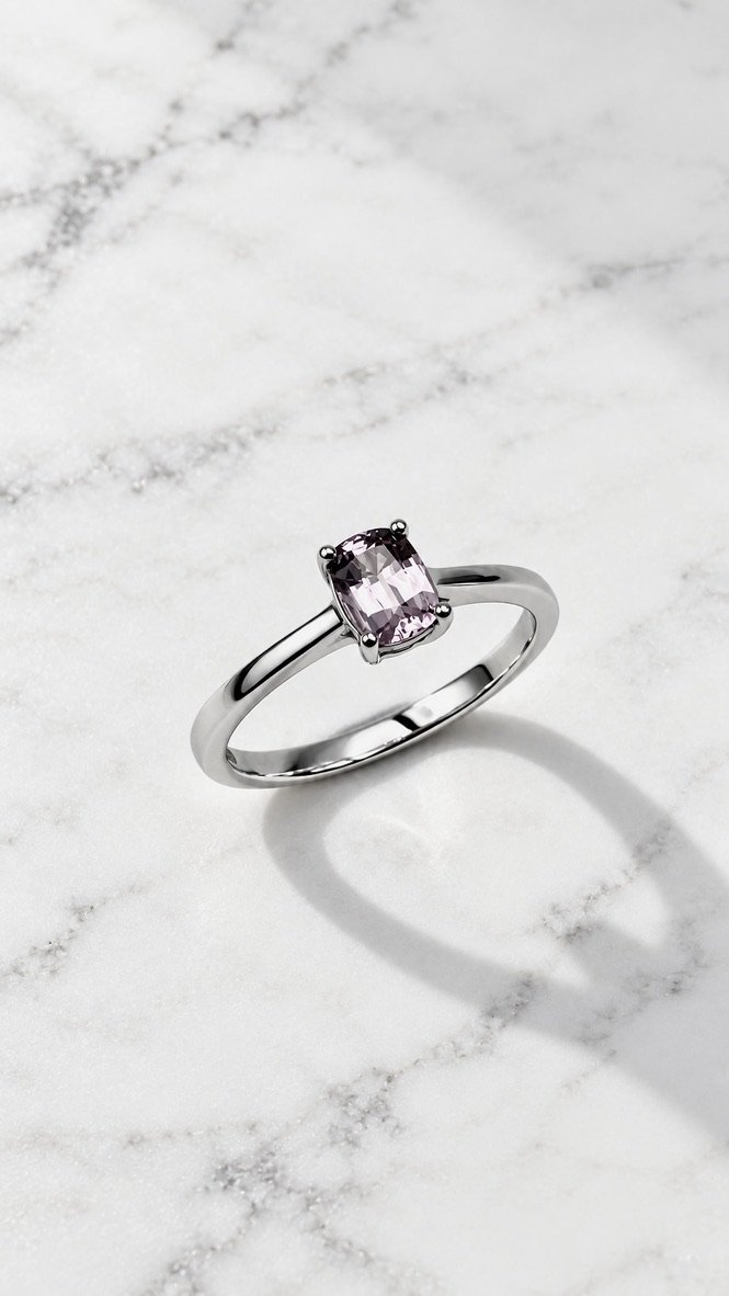Soft pink spinel solitaire ring in 14K white gold, dainty cushion cut, handmade in London