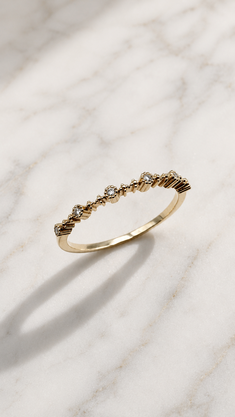 Vintage-style lab-grown diamond ring in 9ct yellow gold — scattered round brilliants in raised vintage-style settings. The Minimal Stack Edit, Gugunava Jewelry, London.