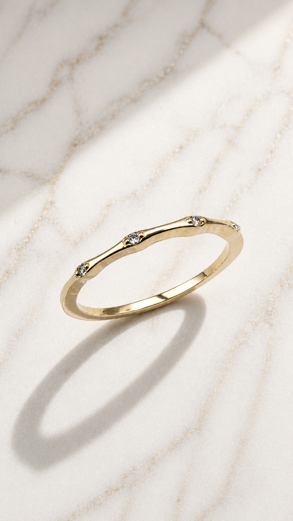 Flush-set lab-grown diamond ring in 9ct yellow gold — round brilliants flush-set into an organic, undulating band. The Minimal Stack Edit, Gugunava Jewelry, London.