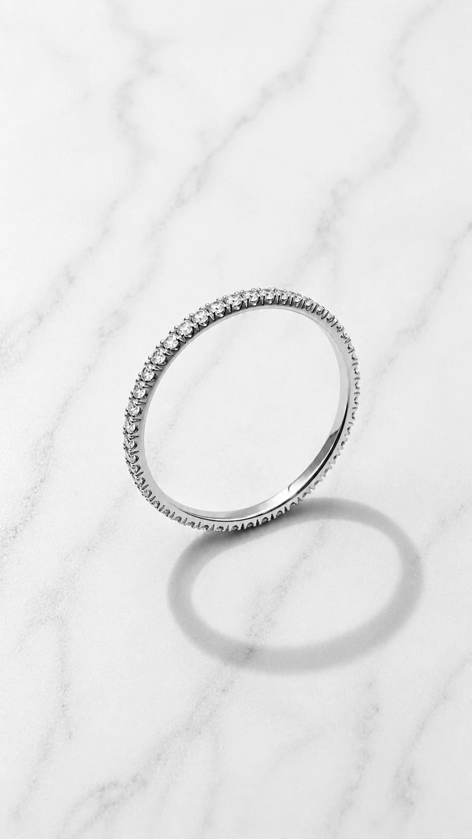 Full Pavé Eternity Ring on marble — 14K white gold band fully set with lab-grown diamond micro-pavé, handcrafted in London by Gugunava Jewelry