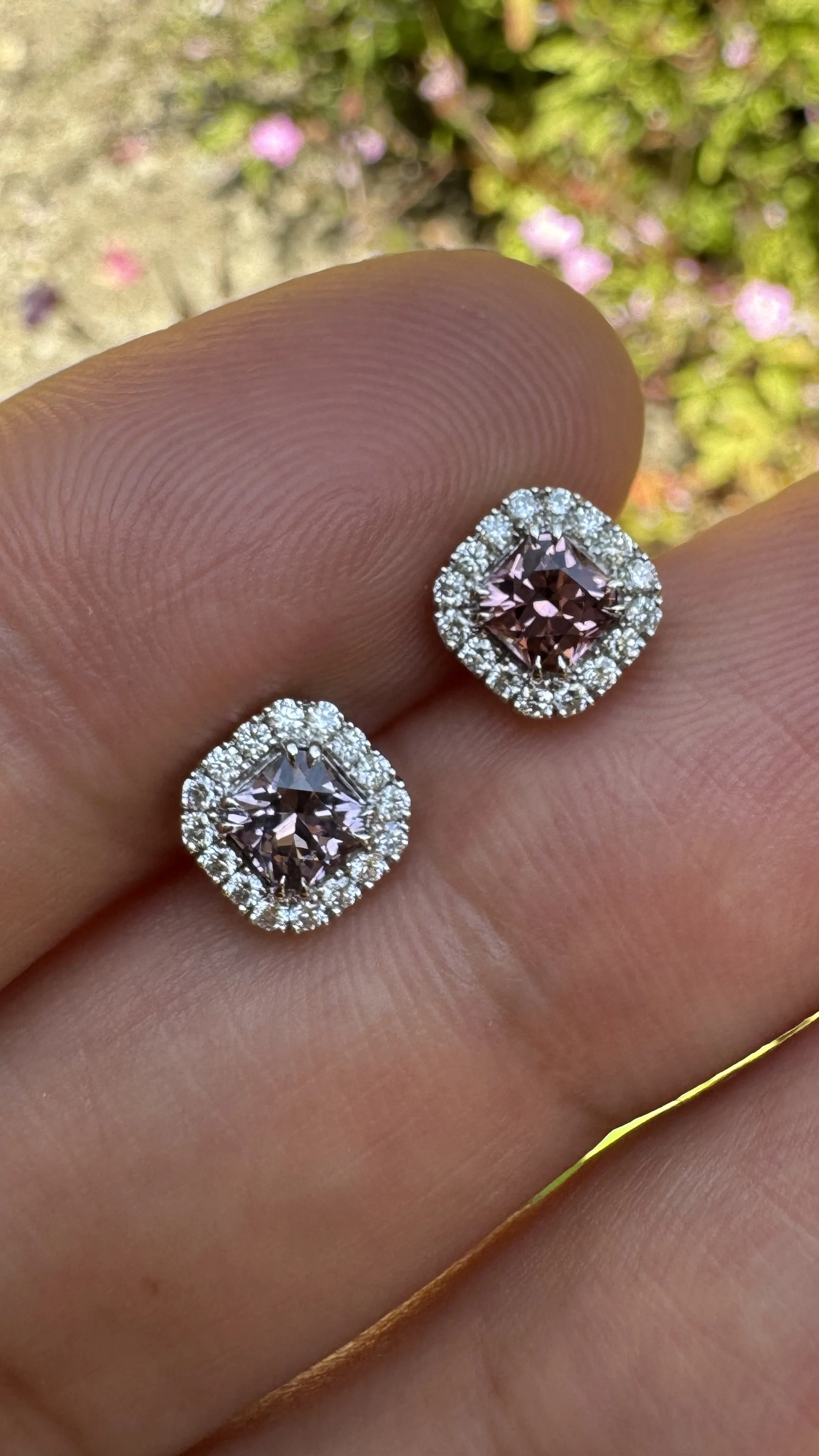 Close-up of Radiant Halo Studs — radiant-cut Burma spinels with castle-set diamond pavé halos in 18K white gold, Gugunava Jewelry London