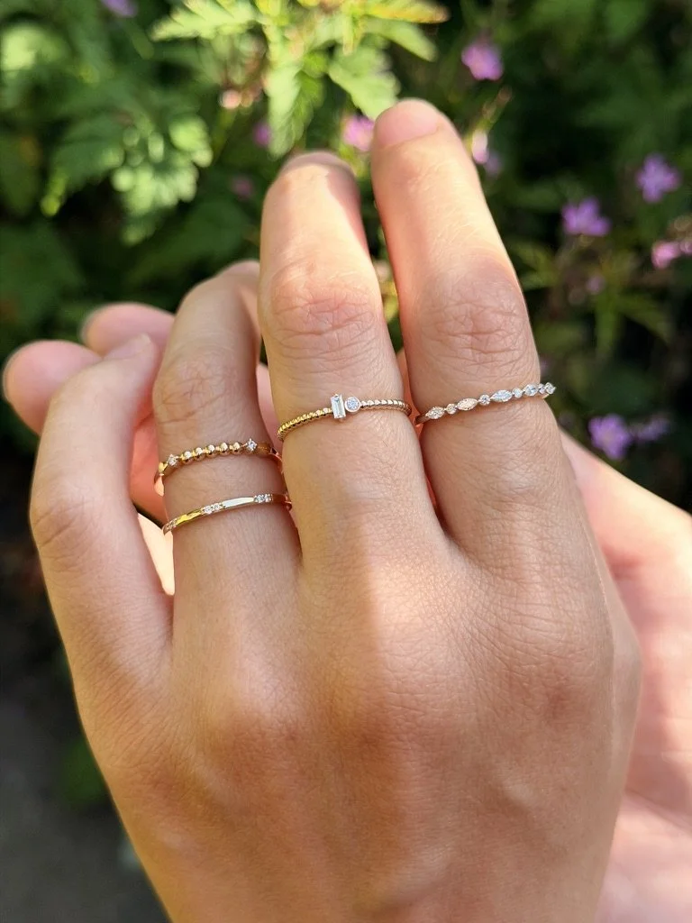 Close-up of a beaded lab-grown diamond ring in 9ct yellow gold — a row of gold beads with a round brilliant at each end. Gugunava Jewelry, London.