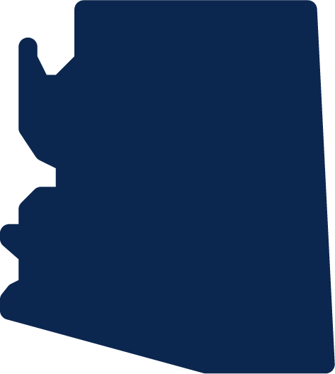 Silhouette of a person running or jumping against a dark background