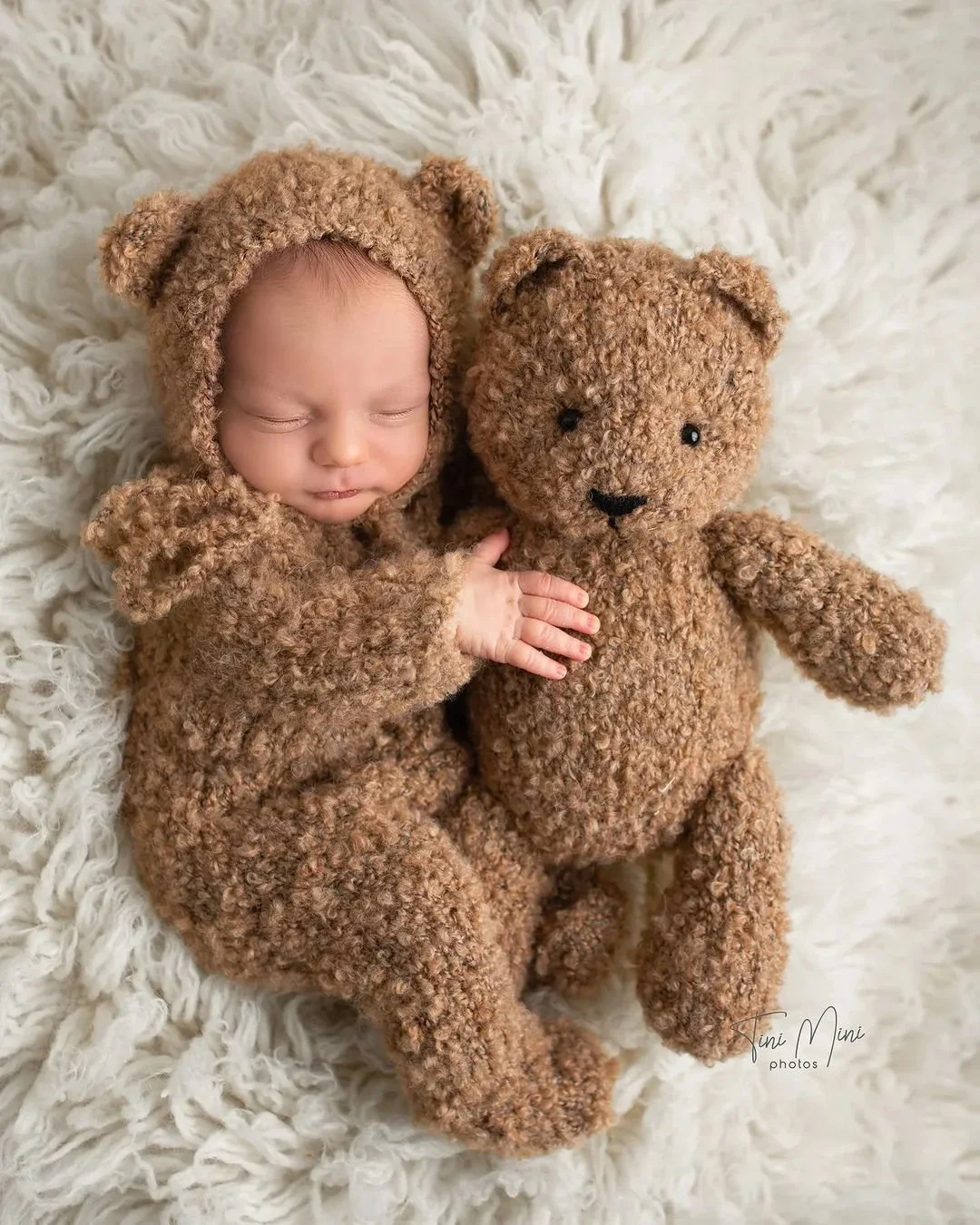 baby wearing cute bear costume teddy bear