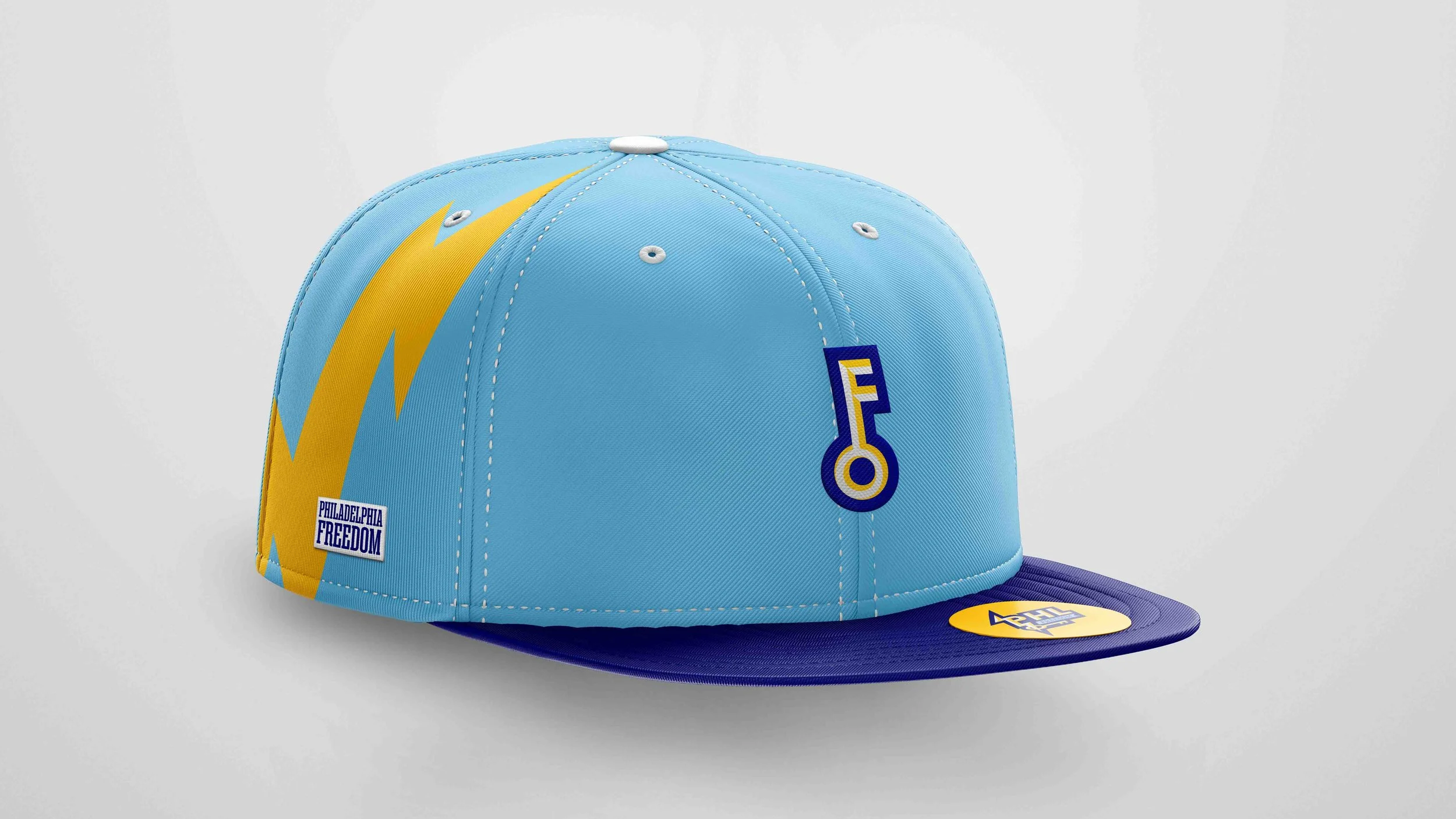 A light blue and dark blue snapback baseball-style hat with a bright yellow lightning bolt graphic on the left side and a yellow and blue stylized “F” key logo on the front, shown against a plain light gray background.