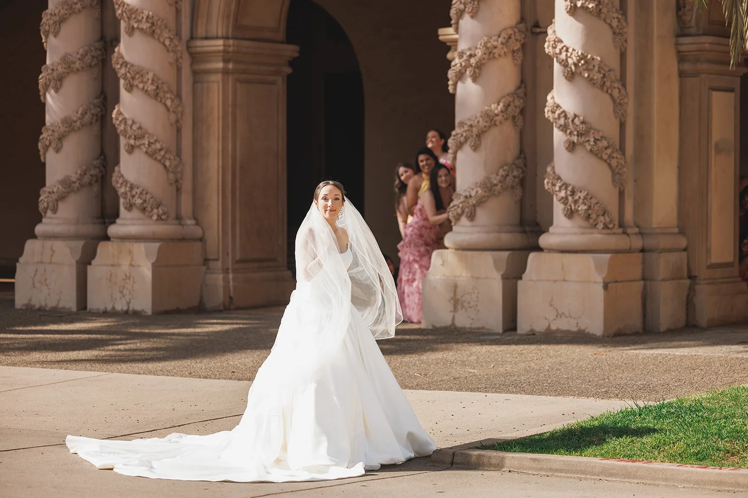 Bride among ornate stone columns