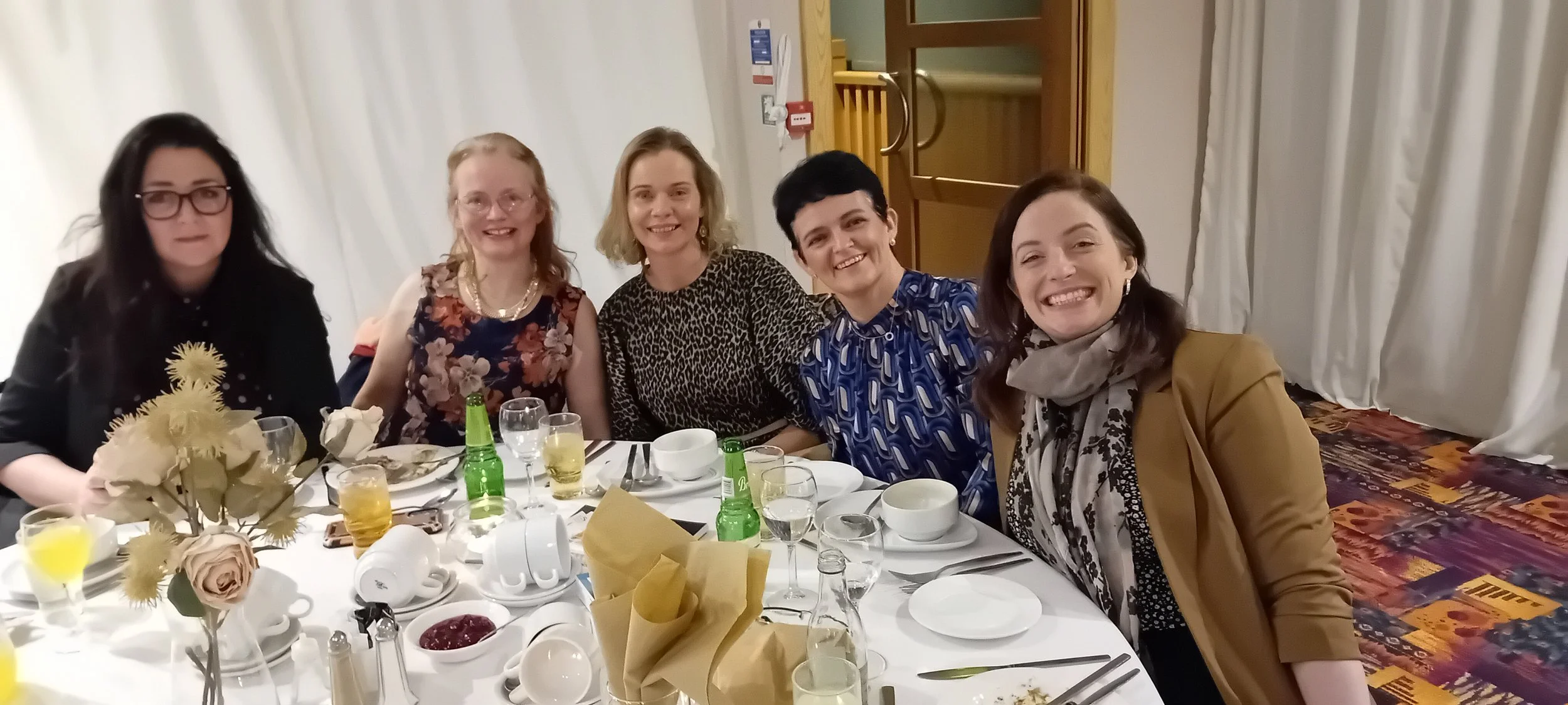 Christmas Night out with Catholic Mothers Ireland Ladies smiling around table.jpg