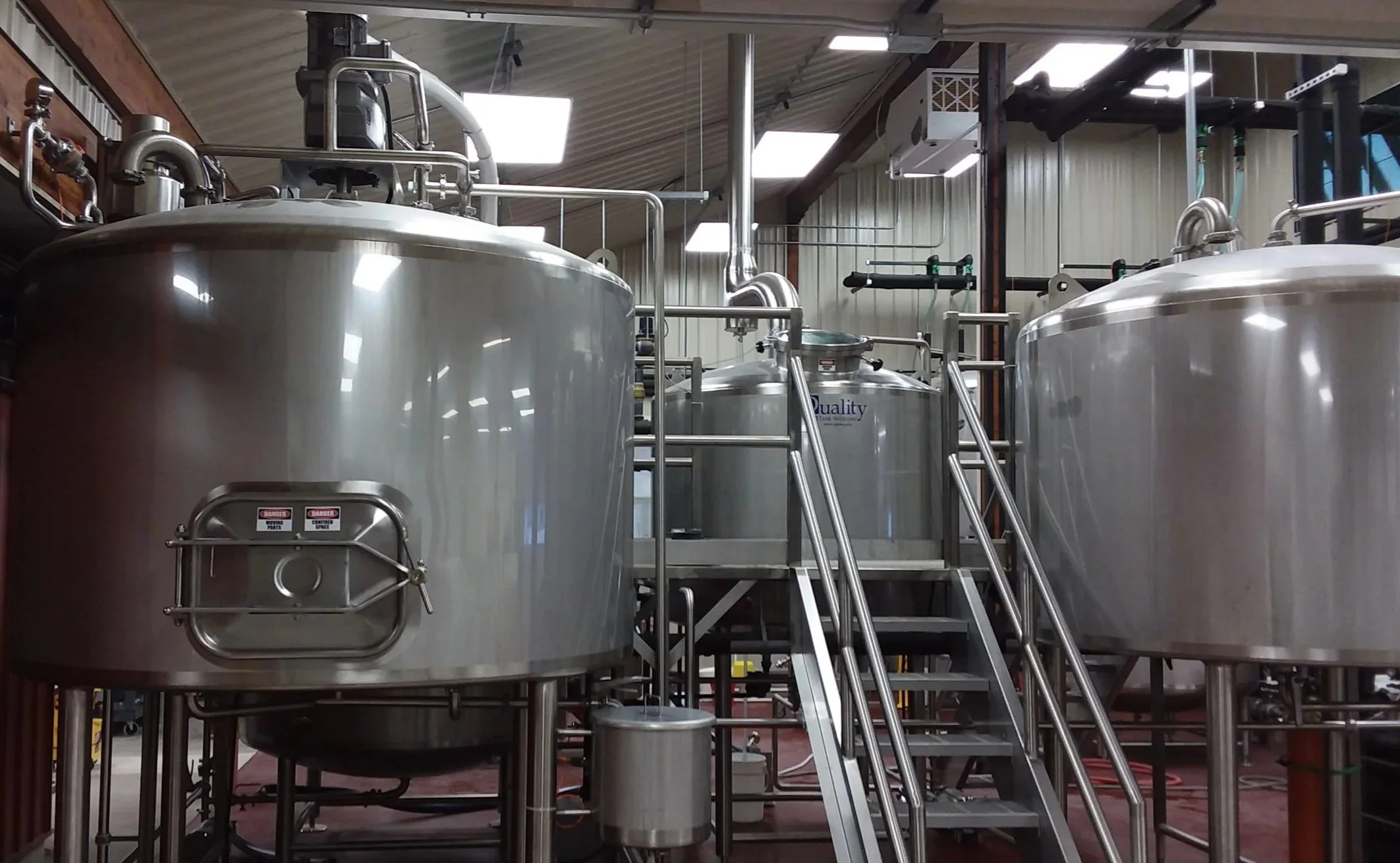 Large stainless steel brewery tanks.