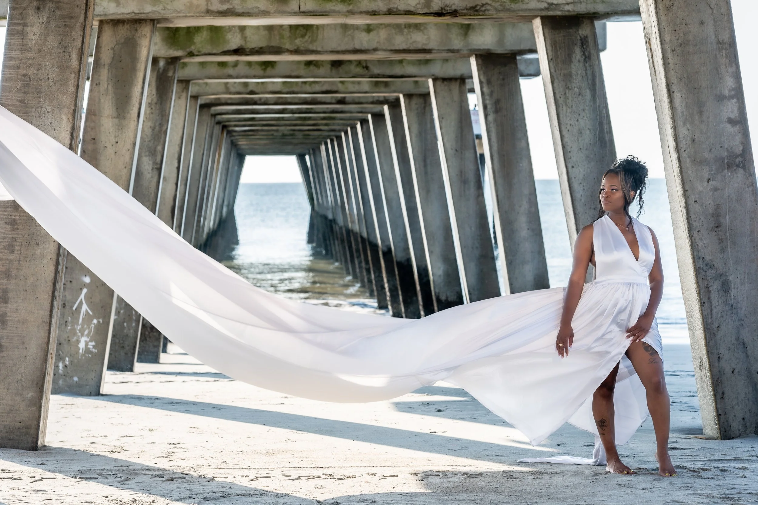 Capture the Magic of a Flying Dress Photoshoot on Tybee Island with Our Professional Photography Services! Elevate your memories with stunning aerial poses, flowing fabrics, and the picturesque backdrop of Tybee Island. Our expert full-time photograp