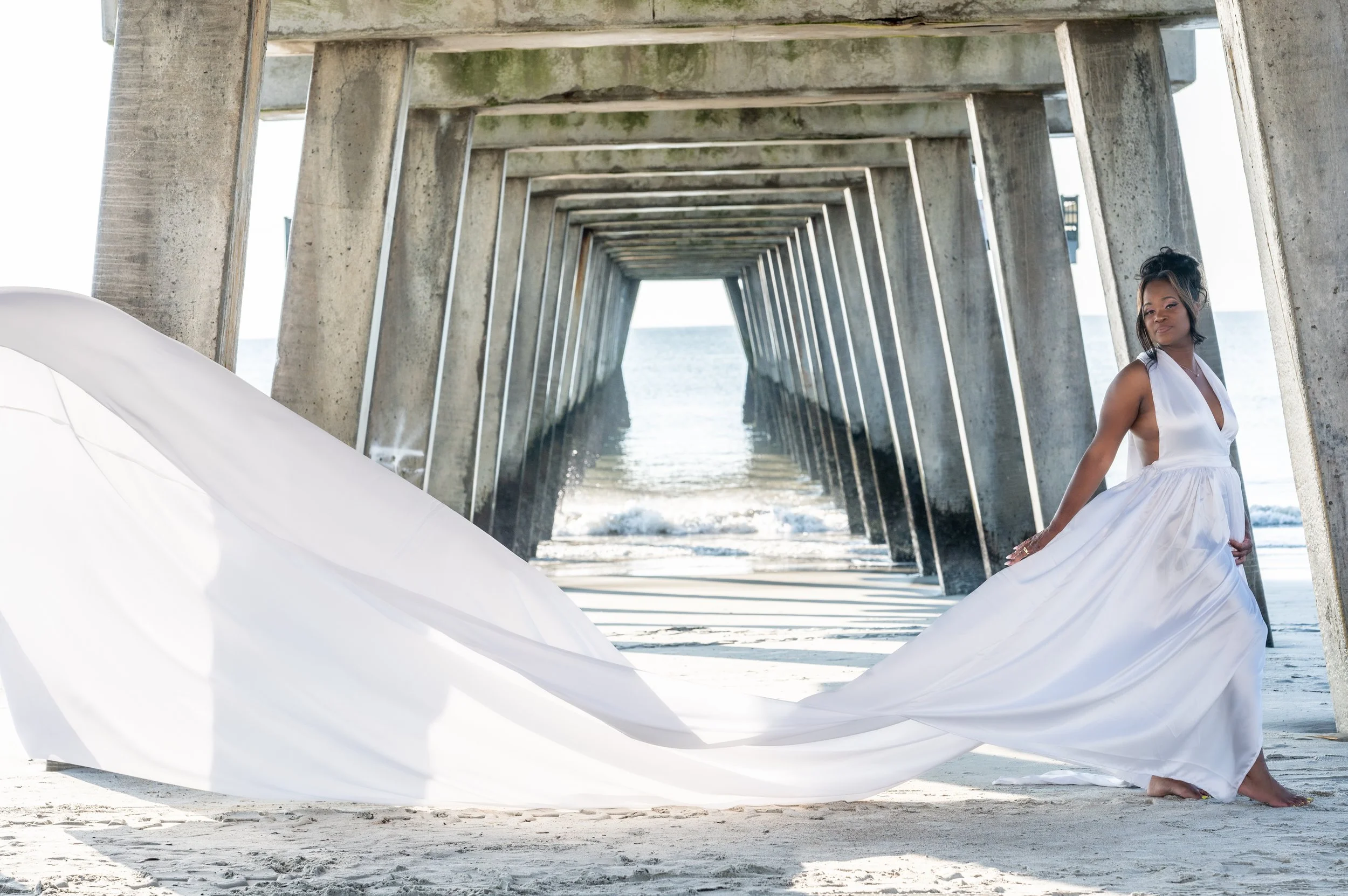 Capture the Magic of a Flying Dress Photoshoot on Tybee Island with Our Professional Photography Services! Elevate your memories with stunning aerial poses, flowing fabrics, and the picturesque backdrop of Tybee Island. Our expert full-time photograp